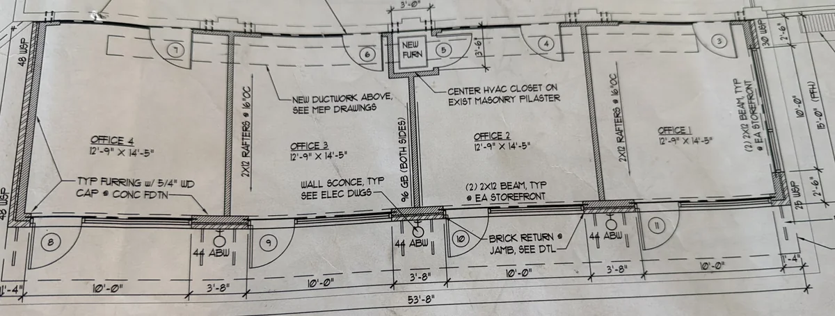 Architect's floor plan of the four 7195 Manchester storefronts; Storefront 1 is Office 1 at the right end, 12 ft 9 in by 14 ft 5 in with the glass storefront along the bottom edge